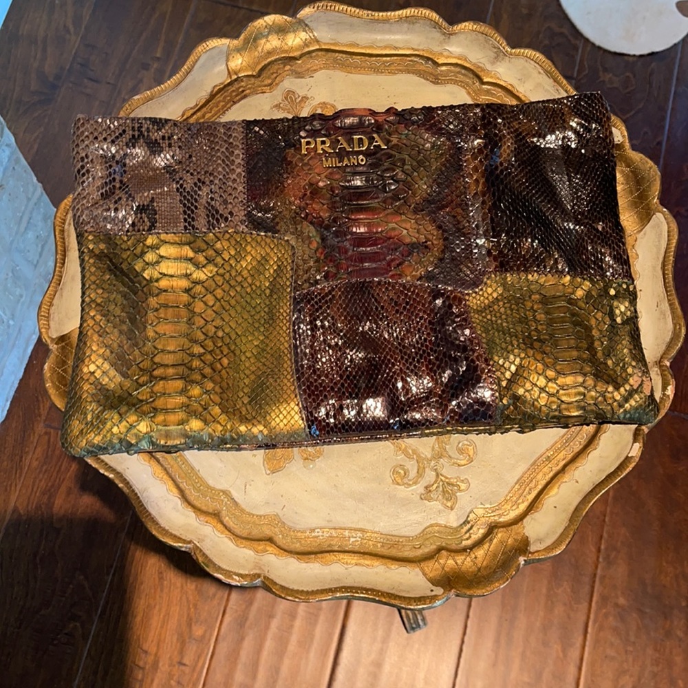 Prada snakeskin clutch. Strap for hand. Multi hues and colors